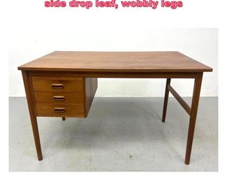 Lot 613 Danish Modern Teak Desk. Missing side drop leaf, wobbly legs 