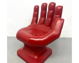 Lot 719 Red Plastic Hand Lounge Chair. 