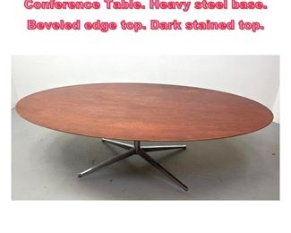 Lot 786 Florence Knoll Oval Dining Conference Table. Heavy steel base. Beveled edge top. Dark stained top. 