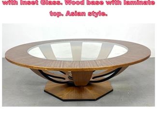 Lot 843 Decorator Round Coffee Table with Inset Glass. Wood base with laminate top. Asian style. 