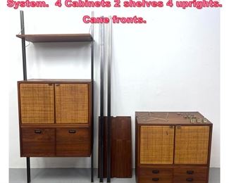 Lot 957 Danish Modern Wall Unit Shelving System. 4 Cabinets 2 shelves 4 uprights. Cane fronts. 
