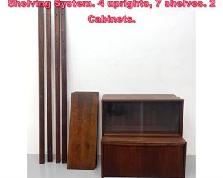 Lot 964 Mid Century Modern Wall Unit Shelving System. 4 uprights, 7 shelves. 2 Cabinets. 
