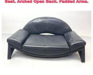 Lot 1002 Modernist Black Leather Love Seat. Arched Open Back. Padded Arms. 