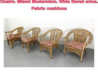 Lot 1012 4pc Woven Rattan Arm Lounge Chairs. Miami Modernism. Wide flared arms. Fabric cushions