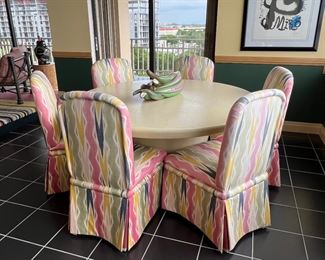 60” Expandable linen dining room table with 2 leaves with 6 chairs with Miro print on wall 31” x 23”