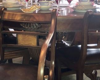 Set of 8 antique chairs with original leather seats.