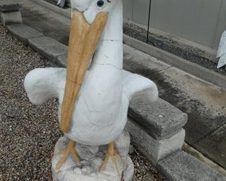 lots of vintage pelican statues