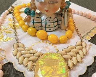 Head vase with vintage jewelry