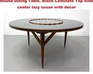Lot 1100 CRAFT ASSOCIATION Modernist Round Dining Table. Black Laminate Top with center lazy susan with decor