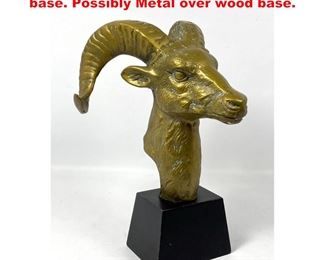 Lot 1128 Brass ram head mounted on black base. Possibly Metal over wood base. 