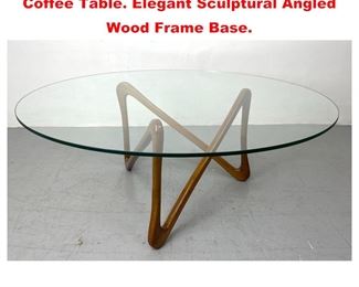 Lot 1176 Italian Modernist style Glass Top Coffee Table. Elegant Sculptural Angled Wood Frame Base.