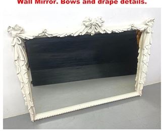 Lot 1321 White Gessoed Faux Rope Trimmed Wall Mirror. Bows and drape details. 