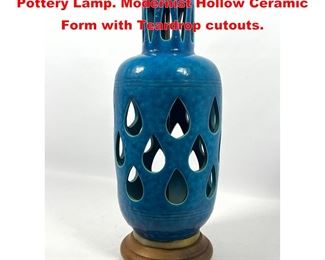 Lot 1369 Modernist Turquoise Glazed Studio Pottery Lamp. Modernist Hollow Ceramic Form with Teardrop cutouts.
