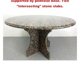 Lot 1524 Granite dining table. Round top supported by pedestal base. Two intersecting stone slabs.