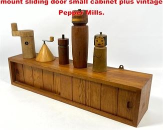 Lot 1631 Pine Charlotte Perriand style wall mount sliding door small cabinet plus vintage Pepper Mills. 