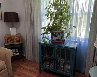 lamps, glass cabinet, curtains, side table