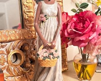 Girl with flower basket figurine 
