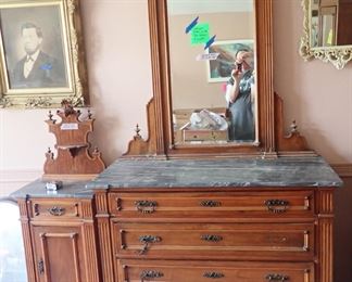 Part of a 3 Piece Bedroom Set. Gray/White Marble Top Dresser and Nightstand With Ornate "Face" Topper.
