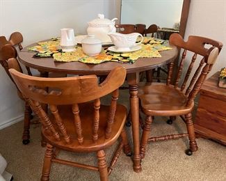 round Tell City style table with four chairs