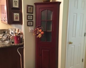 Diminutive corner cabinet