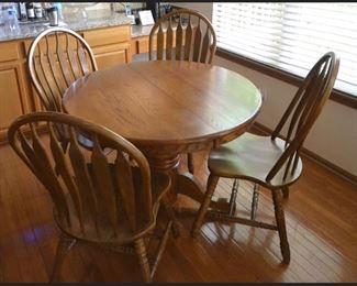 Kitchen Table with Four Chairs and has one Leaf