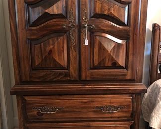 Solid wood chest.  Doors open to glass shelves.