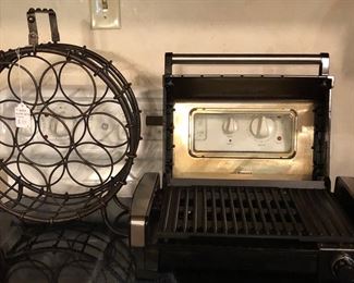 Wine rack-metal and holds 7 wine bottles.  Searing grill to use indoors.