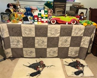 Table fun of toys, wall picture frames and desk picture frames.  Large and small cat rugs.