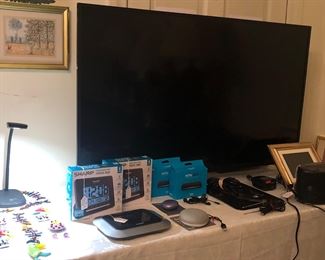 TV-50" Toshiba smart T.V. , fused glass ornaments, Pandigital rotating picture frame, Schumacher Power Converter for a car, Sony radio, alarm clock & cassette player. (Other items already described in another picture)