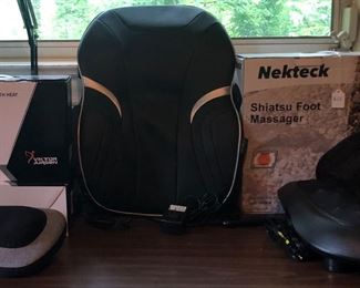Massagers-we have a lot of them.  Far left a Viktor Jurgen Shiatsu Massager Pillow with Heat .  The large on is a back massager with vibration, and heat too.  On the right is a Nekteck Shiatsu Foot Massager.  It helps with blood circulation and warms the feet.  