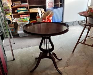 Table with lyre/harp design