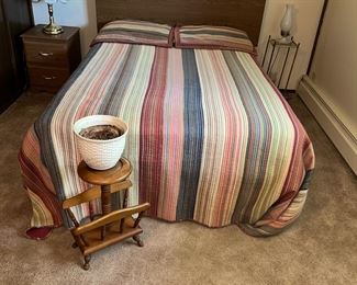 Bed w/ couple of end tables. magazine rack and the planter is  Heager.
