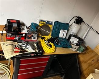 Great variety of power tools and note the great Craftsman tool cabinet w/ drawers on the left and a door (opened) on the right.