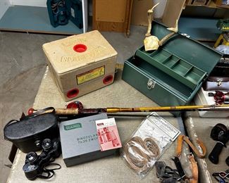 binoculars, fishing poles, ice cleates, tackle box, worm farm box