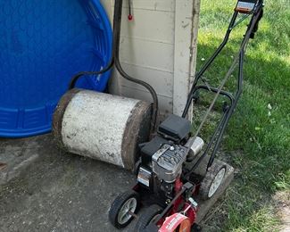 One cement roller and one 9 inch edger blade by Briggs & Stratton.