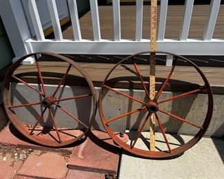 Two metal wagon rims.