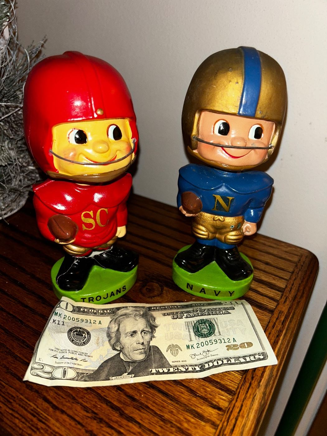 Two early circa 1960’s nodders: Navy collegiate bobble head - nodder and University of Southern Cal collegiate bobble head - nodder.