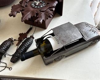 Cuckoo clock and an automotive wine holder.