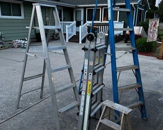 Hey! We’ve got the worlds greatest ladder )COSCO multi use ladder) in the middle, an 8 foot Keller step ladder on the right, a 6’ aluminum stepladder on the left and the small 2 step ladder.