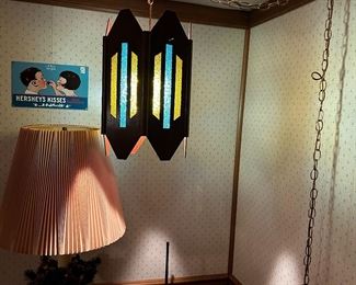 Just one of the many chain hanging lights lit up showning its colors.