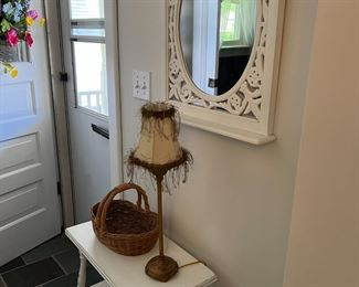 Painted mirror, table, tall candlestick lamp, basket