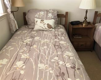 2 twin beds and a nightstand