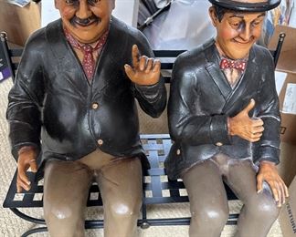 LAUREL AND HARDY SITTING ON BENCH