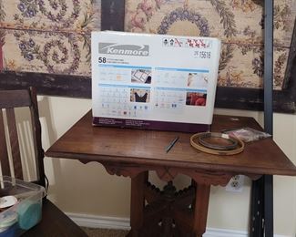 sewing machine, carved wood table