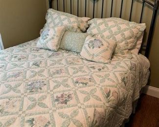 Very pretty bed, I believe it's a queen.