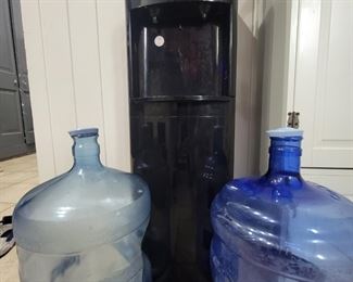 Water cooler with three refillable 5 gallon jugs
