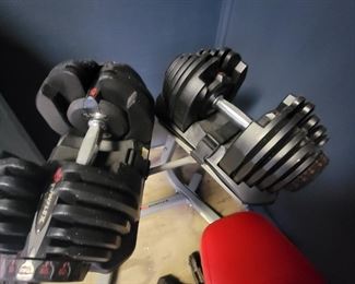 Bowflex adjust weights 90 lbs per.  Also includes holding rack and bench