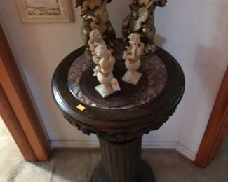 Pedestal table and cherubs