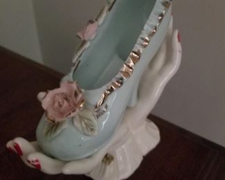 Mid century hand holding shoe vase