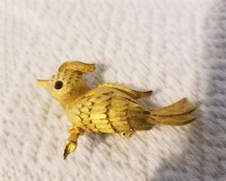 Textured gold-tone bird on a branch pin/brooch